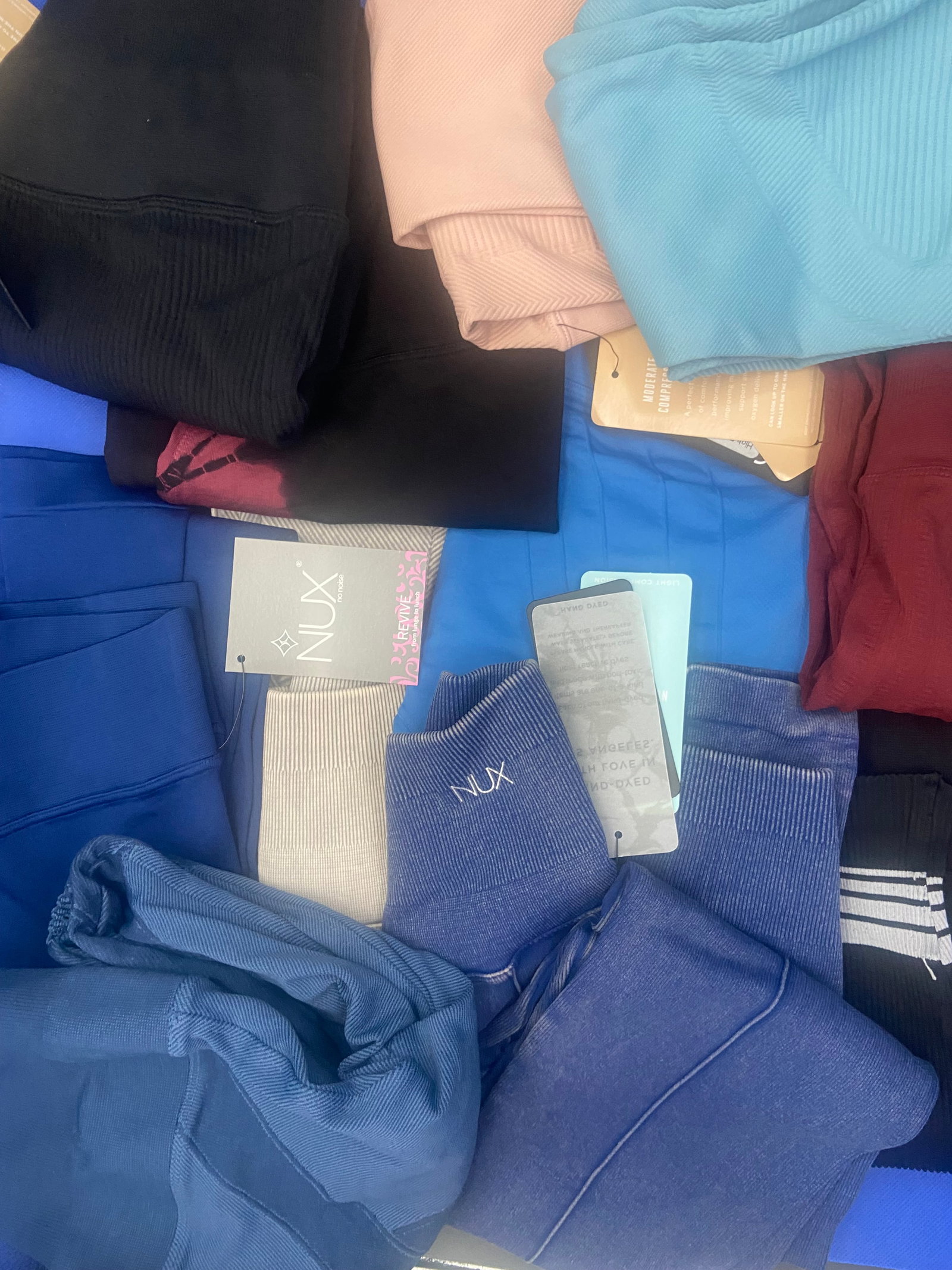 Brand New with tags Activewear: Large lot of Brand New with tags NUX activewear leggings. A variety of colors and styles. 9 are size small and 2 are. size x-small. Lot of 11 total High Estimate: 500.00