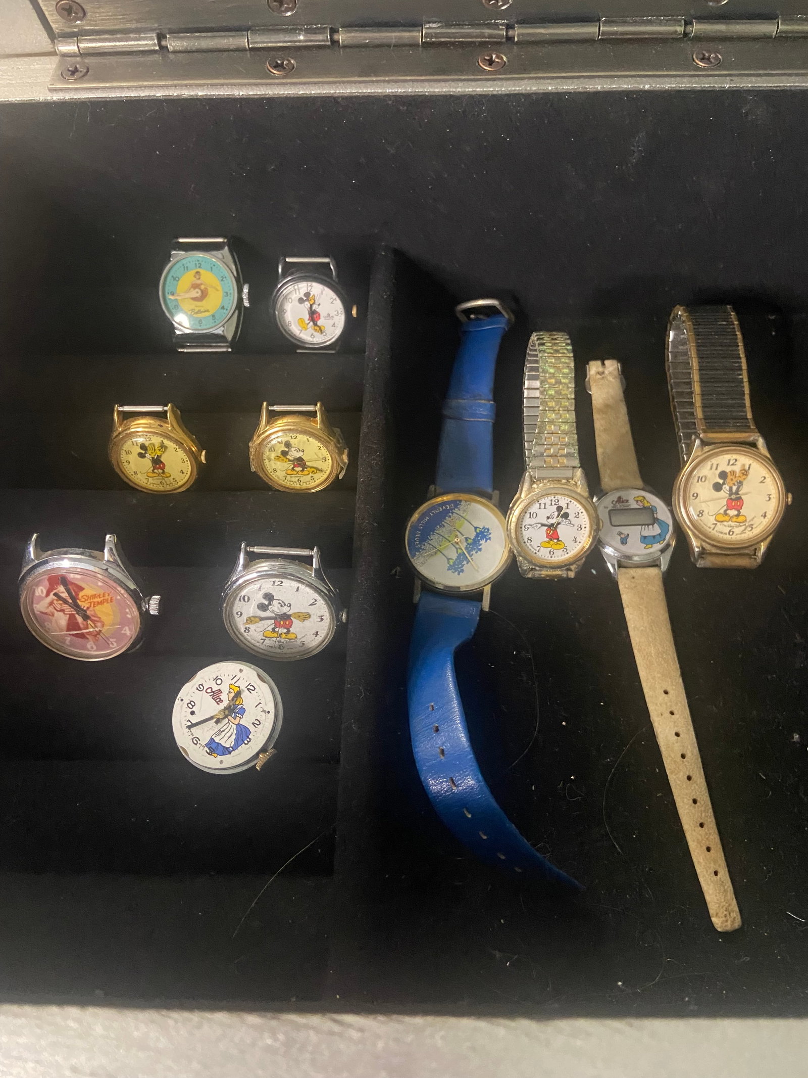 Vintage Character Watches Collection: Collection features a variety of vintage watches themed after popular characters, including Mickey Mouse, Shirley Temple and Alice in Wonderland. The watches come in various styles and colors,