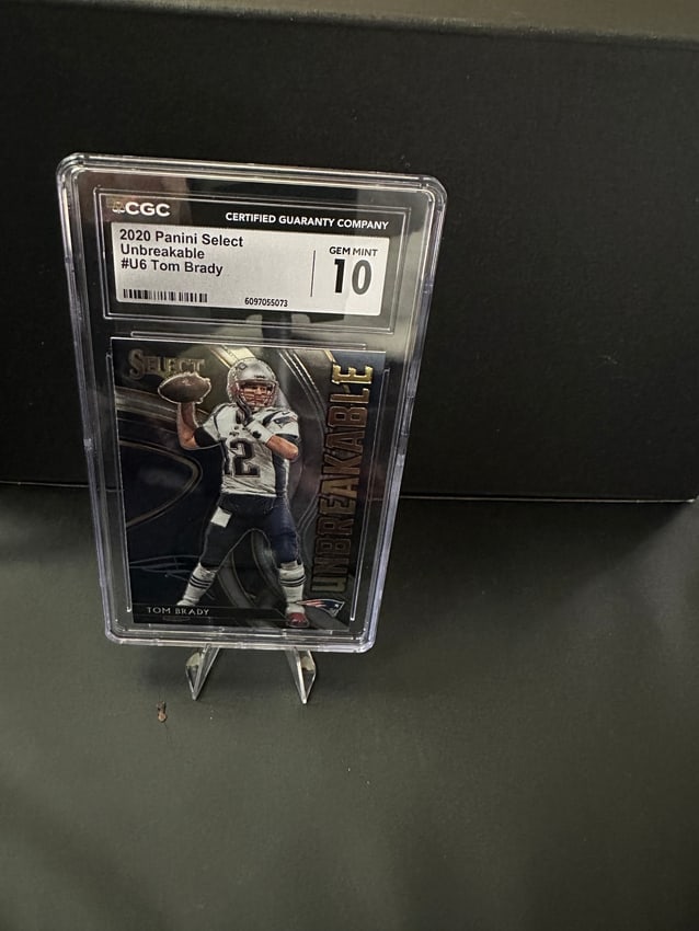 2020 Panini Select Unbreakable #6 Tom Brady - Gem Mint 10: a 2020 Panini Select Unbreakable trading card featuring Tom Brady, numbered #6. The card is graded Gem Mint 10 by the Certified Guaranty Company (CGC), indicating its pristine condition. This collecti