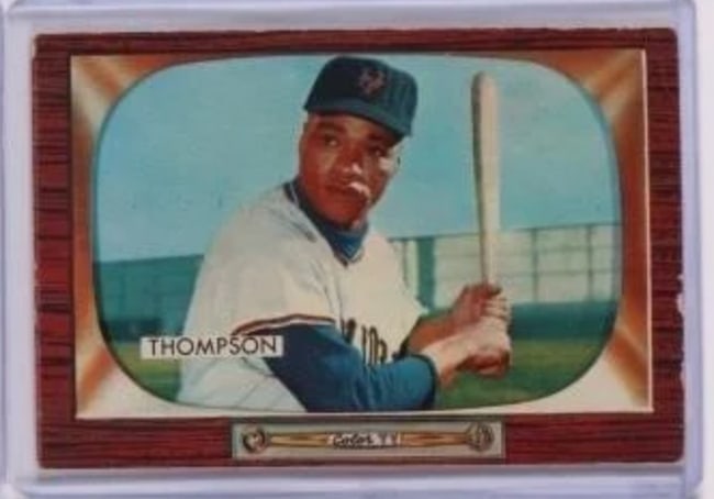 1955 Bowman Baseball Card - Hank Thompson: Vintage 1955 Bowman baseball card featuring Hank Thompson, depicted in a batting pose. The card showcases vibrant colors typical of the Topps series from this year, framed with a retro wood-like desig