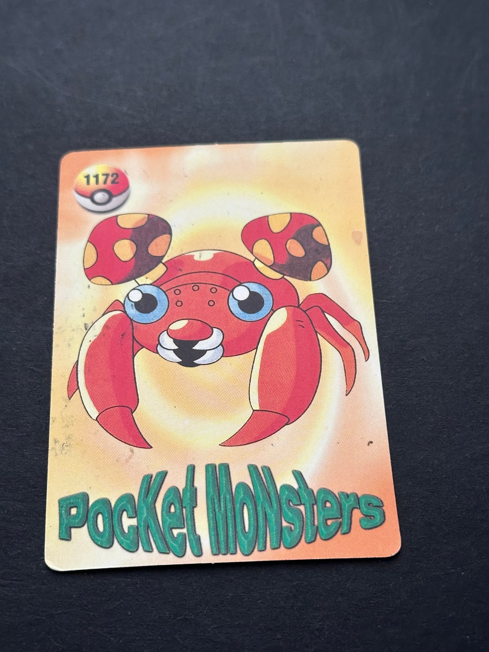 Paras Pokémon Card Sticker 1172: a vintage Japanese Pocket Monsters card sticker featuring the Pokémon Paras. The card displays the character art on a yellow-to-orange gradient background with the text Pocket Monsters printed vertic