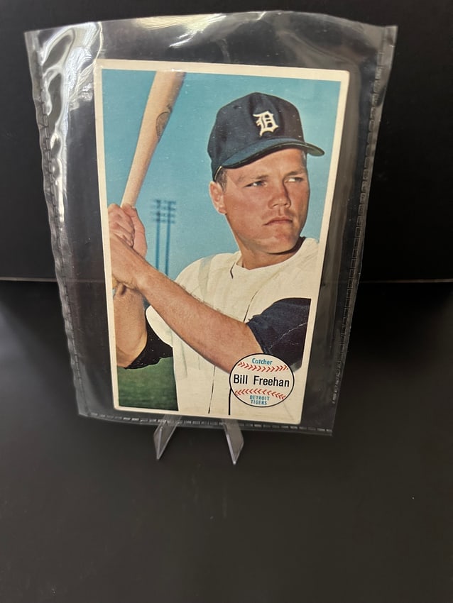 1964 Topps Giants Bill Freehan Baseball Card: This is a 1964 Topps Bill Freehan baseball card featuring the former catcher for the Detroit Tigers. The card showcases Freehan poised with a bat, capturing the essence of the sport. It is encapsulate