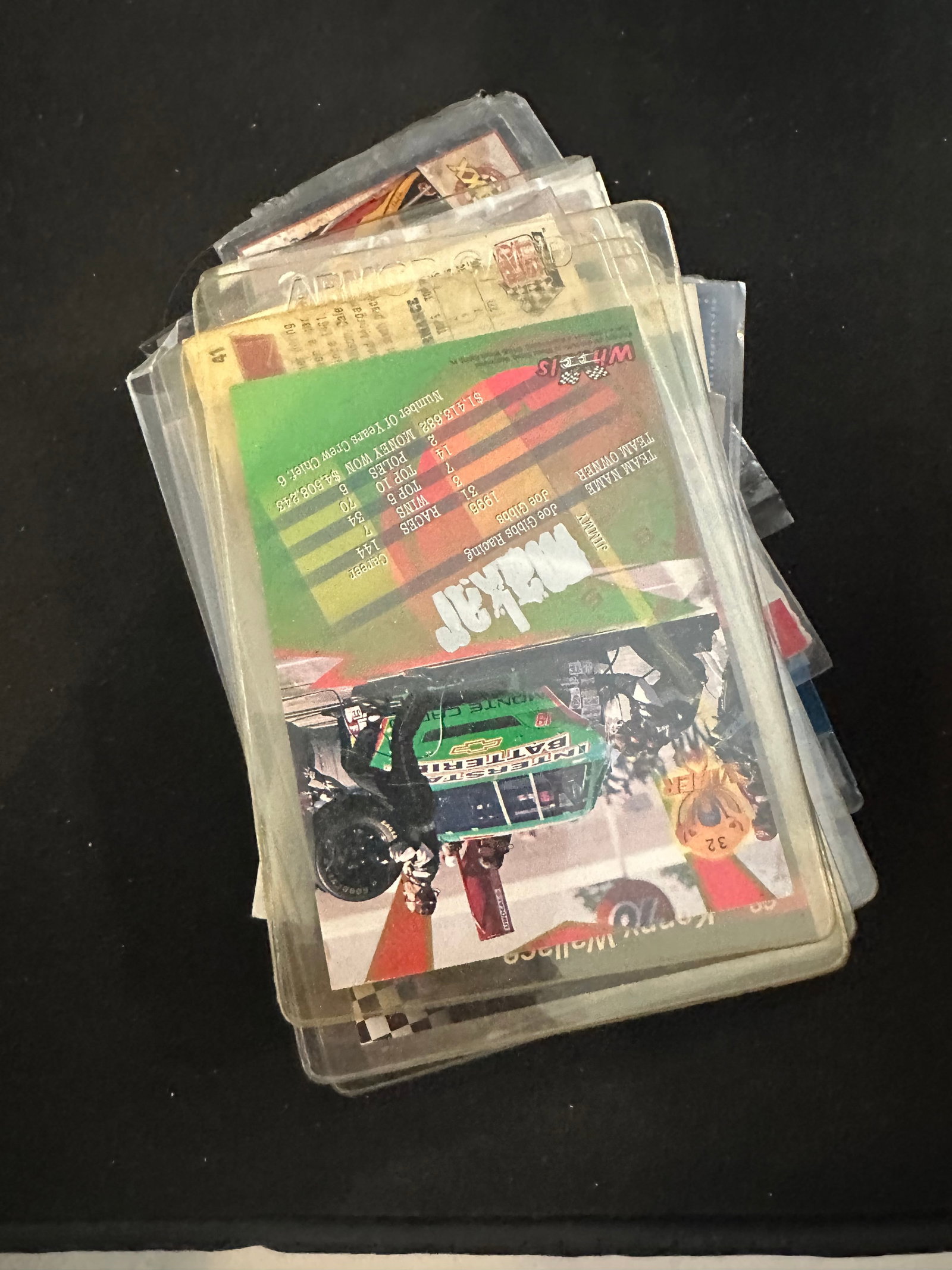 Vintage - Large lot -NASCAR and other racing Trading Cards: Lot is mostly Sleeved and or in Top loaders - Top Loaders are very dusty and dirty -