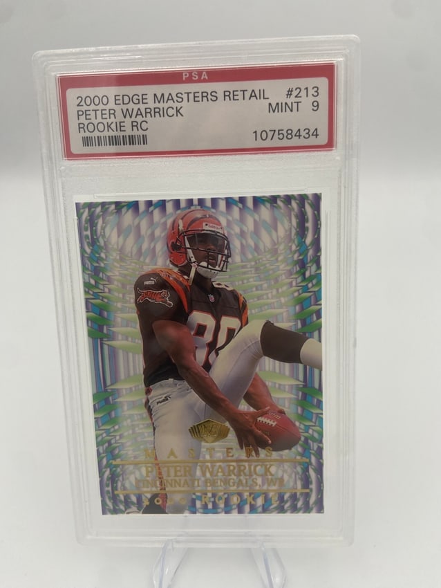 2000 Edge Masters Peter Warrick Rookie Card: A 2000 edge masters retail #213 trading card featuring peter warrick, a rookie wide receiver for the cincinnati bengals. It is graded mint 9 by psa, showcasing its excellent condition. The card