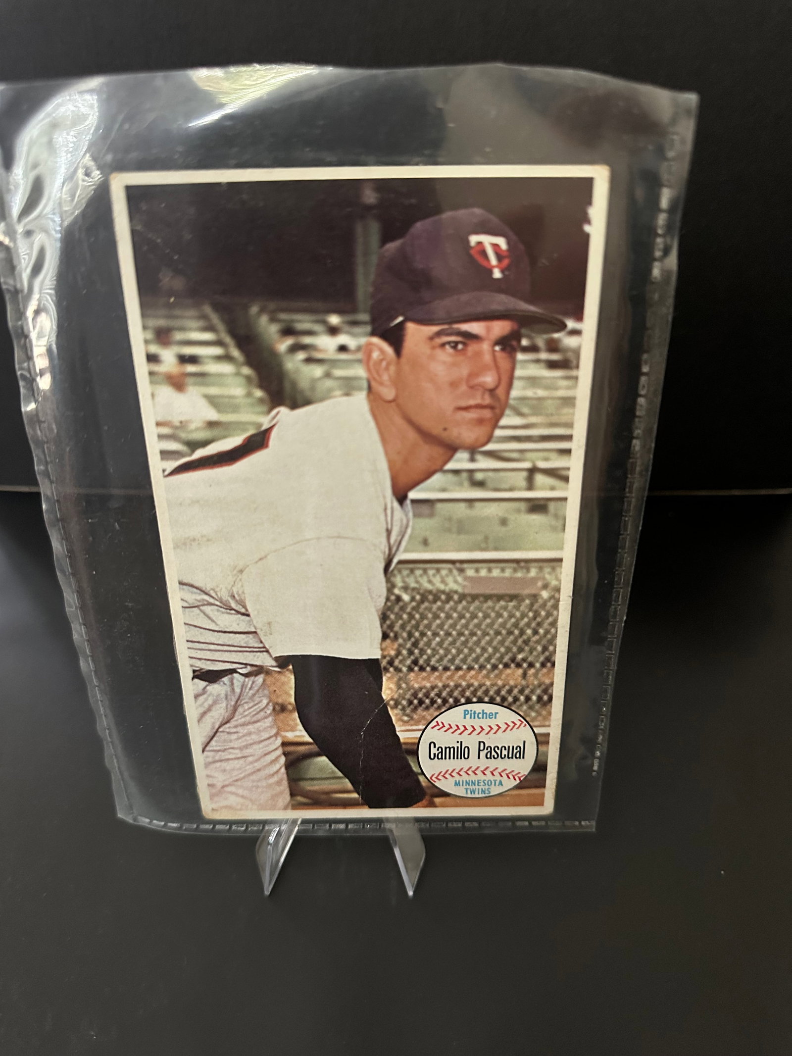 Giant 1964 Camilo Pascual Baseball Card: 1964 topps giant baseball card featuring camilo pascual, a pitcher known for his time with the minnesota twins. The card is in good condition and displays pascual wearing his team cap, showcasing the