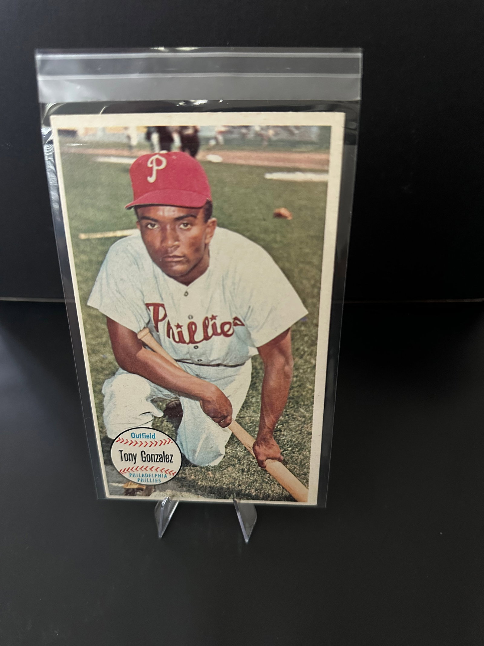 1956 Topps Giant Tony Gonzalez Baseball Card: 1956 topps baseball card featuring tony gonzalez, an outfielder for the philadelphia phillies. The card showcases a stunning color image of gonzalez in his phillies uniform, holding a bat, with the ic