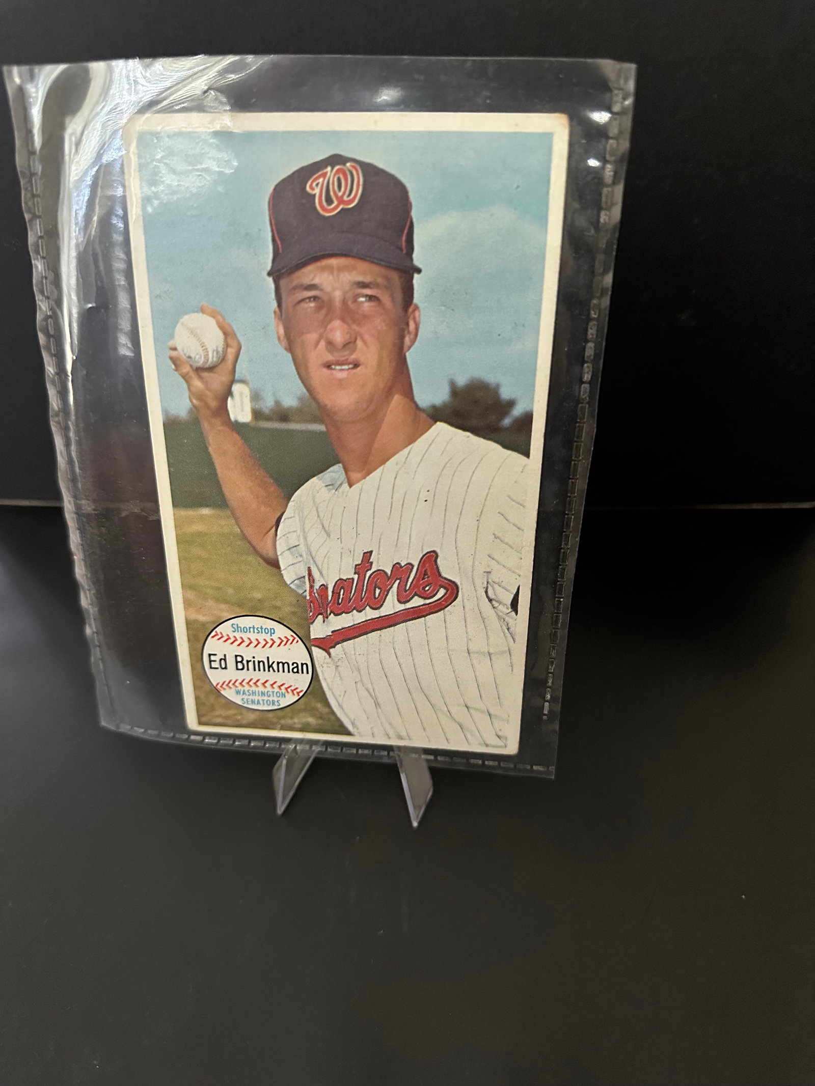 1964 Topps Giants Ed Brinkman #27: 1964 topps giants - baseball card featuring ed brinkman, who played for the washington senators. The card showcases brinkman in his team uniform, holding a baseball, with notable details like the
