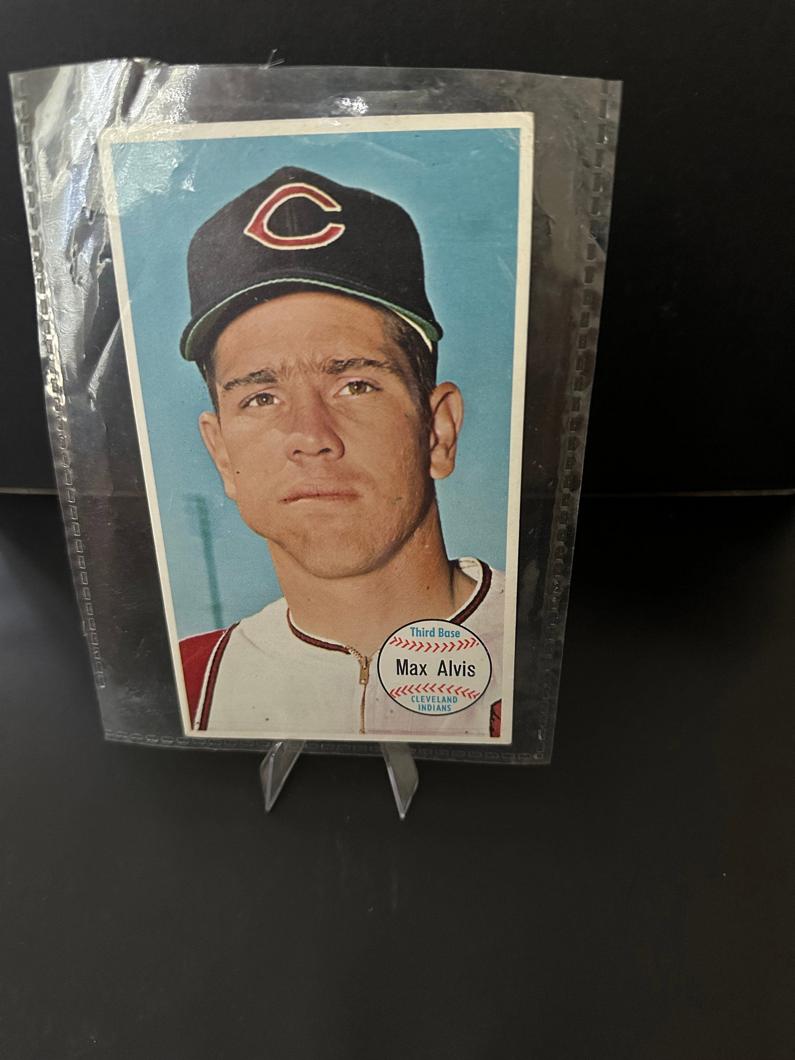1964 Topps Giants Max Alvis Baseball Card: Vintage 1964 topps max alvis baseball card, featuring the player in a cincinnati reds uniform. The card highlights alvis as a third baseman, and it is notable for its vibrant colors and classic