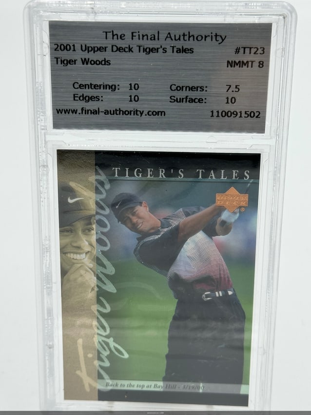2001 Upper Deck Tiger's Tales Tiger Woods Card: 2001 upper deck tiger's tales trading card featuring tiger woods, card number tt23. It is graded nmmt 8, with centering and edges rated at 10, corners at 7. 5, and surface at 10. The card showcases