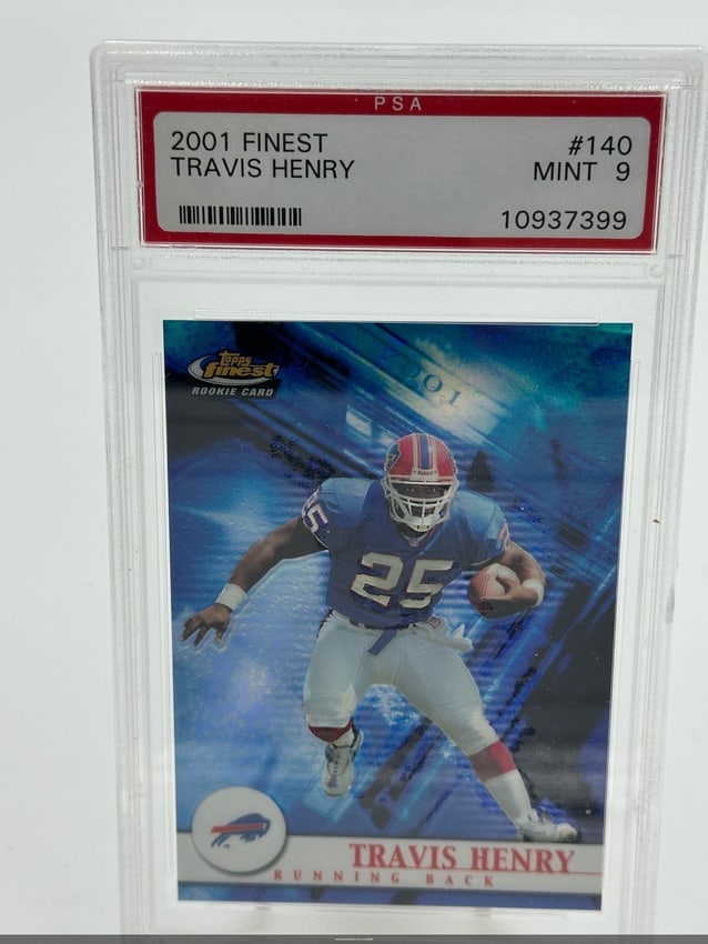 Rookie Card -2001 Topps Finest Travis Henry Rookie Card: This is a 2001 topps finest rookie card featuring travis henry, a running back who played for the buffalo bills. The card is graded psa mint 9 and is numbered #140. It showcases a vibrant design typic