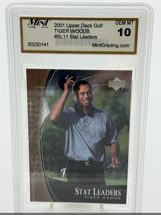 2001 Upper Deck Tiger Woods Stat Leaders Card: 2001 upper deck golf card featuring tiger woods, titled '#sl11 stat leaders. ' the card is graded gem mt 10, indicating it is in mint condition, and showcases woods celebrating on the course. This
