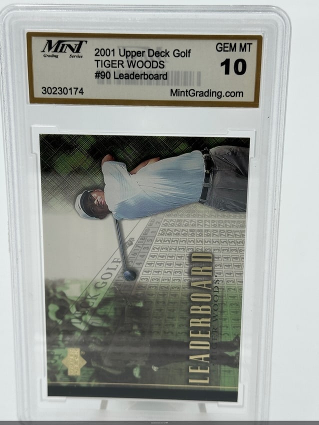 2001 Upper Deck Golf Tiger Woods #90 Leaderboard Card: A 2001 upper deck golf trading card featuring golf legend tiger woods, numbered #90 from the leaderboard series. The card is graded a gem mt 10, indicating it is in mint condition. This collectible