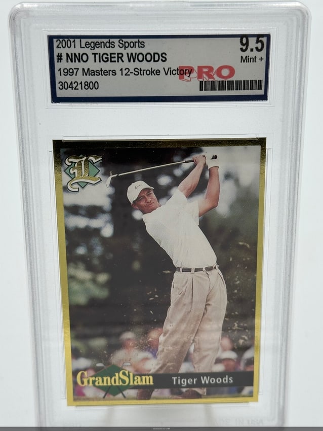 2001 Tiger Woods Legends Sports Card: This collectible features tiger woods, capturing his historic 1997 masters victory by 12 strokes. It's a 2001 legends sports card, specifically numbered nno, showcasing woods in action. The card is gr