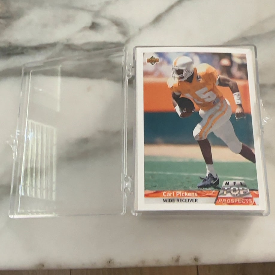 This is a 1992 GOLD Upper Deck NFL football cards: Unsorted - Set May Be incomplete -This is a 1992 GOLD Upper Deck NFL football card featuring NFL Top Prospects and Players is housed in a clear plastic protective case.
