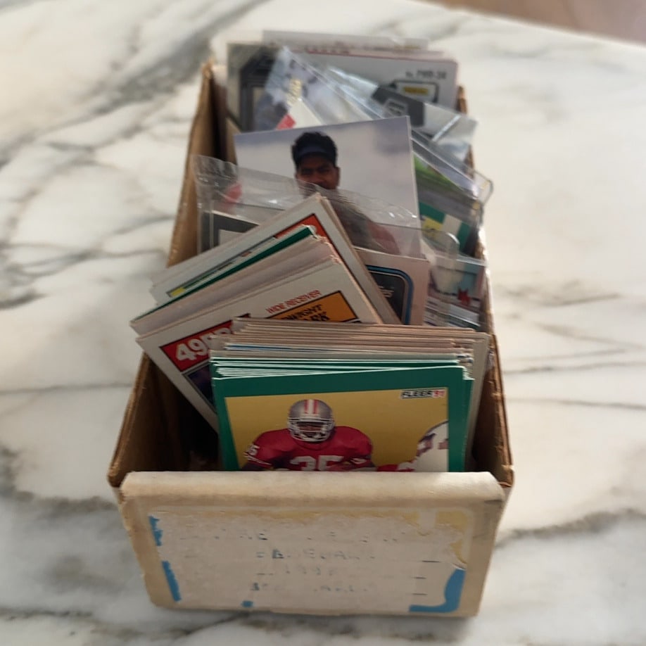 Assorted Vintage and Mondern Football Trading Card Collection: A collection of vintage and Modern football trading cards stored in a cardboard storage box. See Other Pictures for other cards in Box