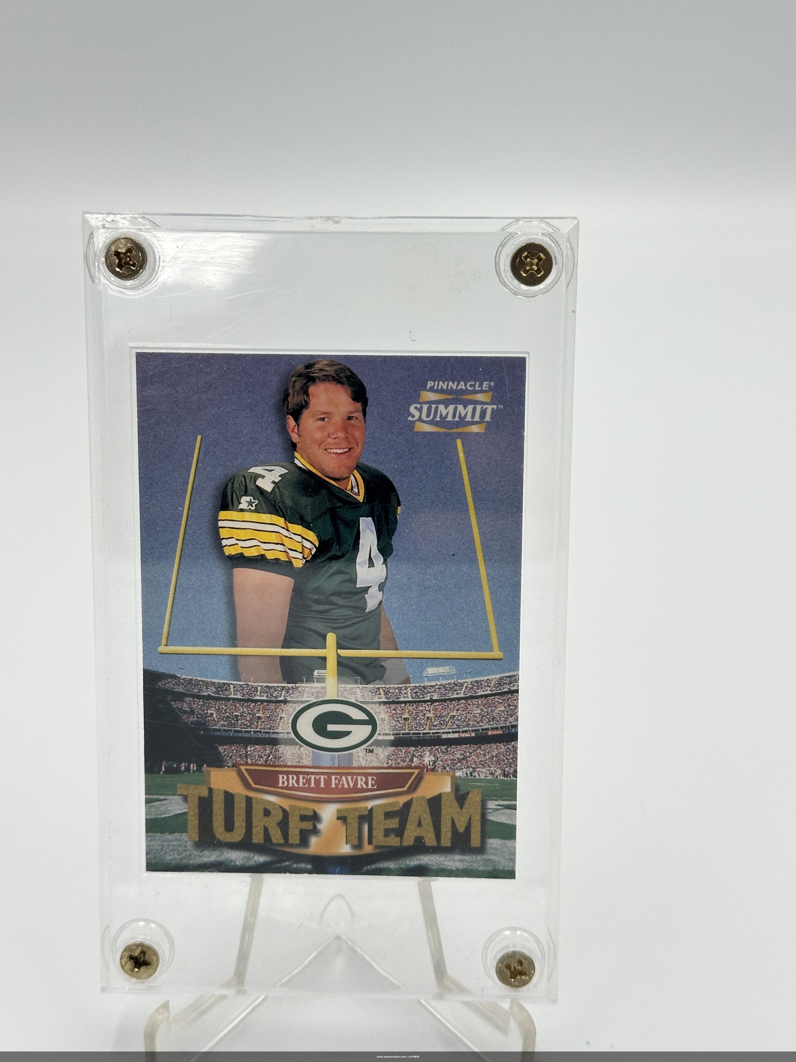 Brett Favre Pinnacle Summit Turf Team Card 1996: Brett favre 'turf team' card from the pinnacle summit series, featuring the legendary quarterback in his green bay packers uniform. The card showcases an image of favre with a football field backgroun
