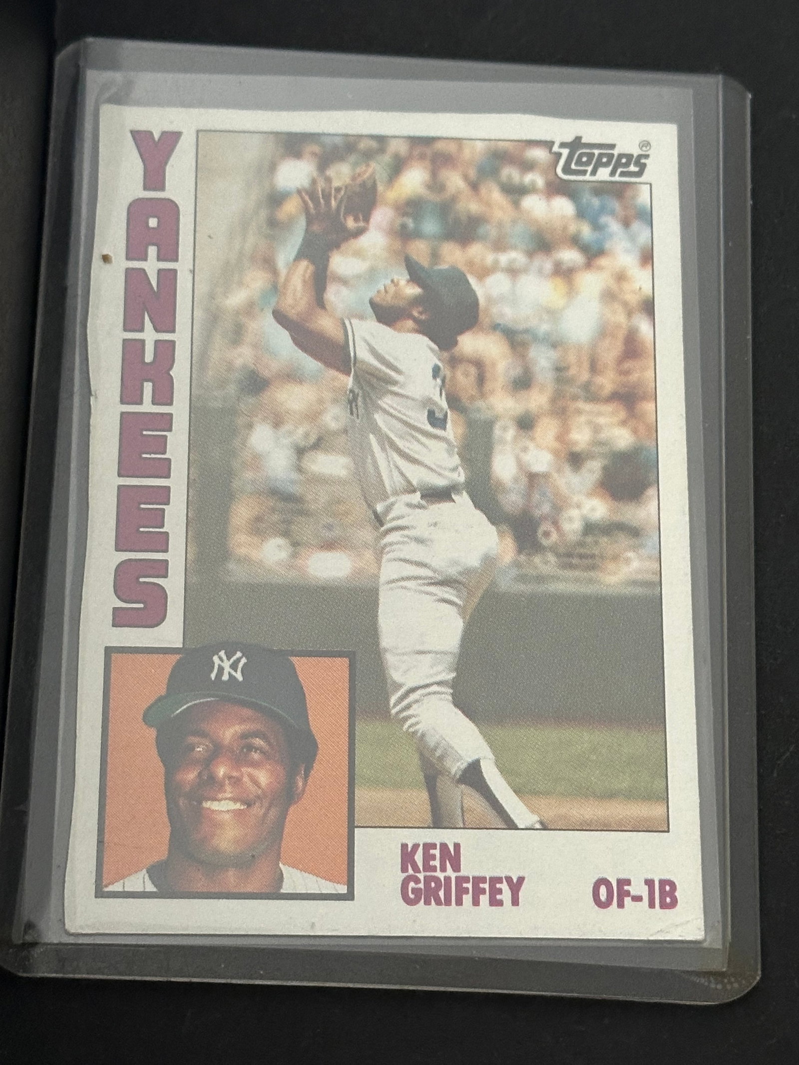 1974 Topps Ken Griffey Sr. New York Yankees Card: 1974 topps baseball card featuring ken griffey sr. Playing for the new york yankees. The card shows the outfielder in a diving catch pose alongside a portrait insert.