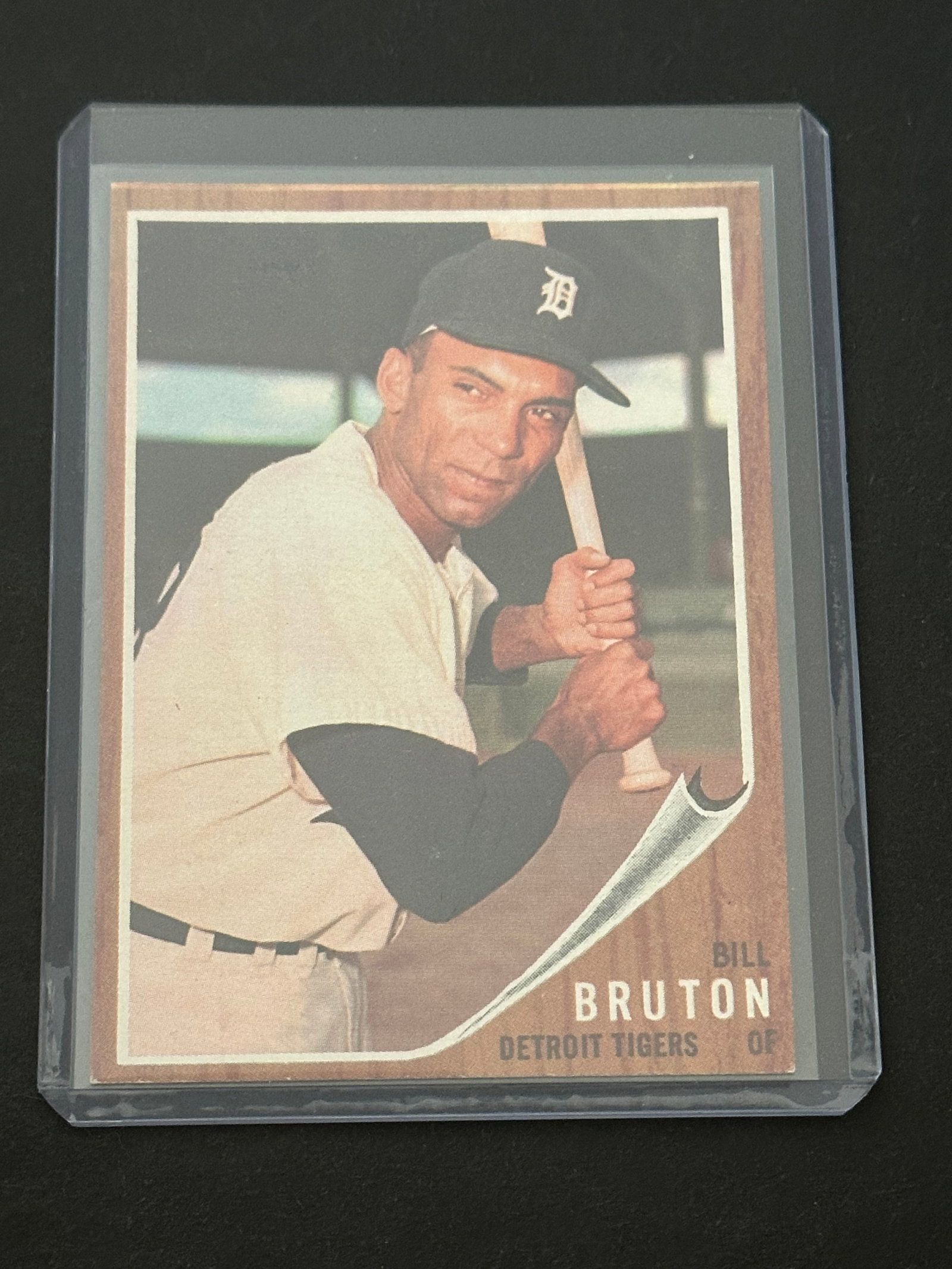 1962 Topps Bill Bruton #386: 1962 topps baseball card featuring detroit tigers outfielder bill bruton. The card features a distinct wood-grain border design characteristic of the 1962 topps set