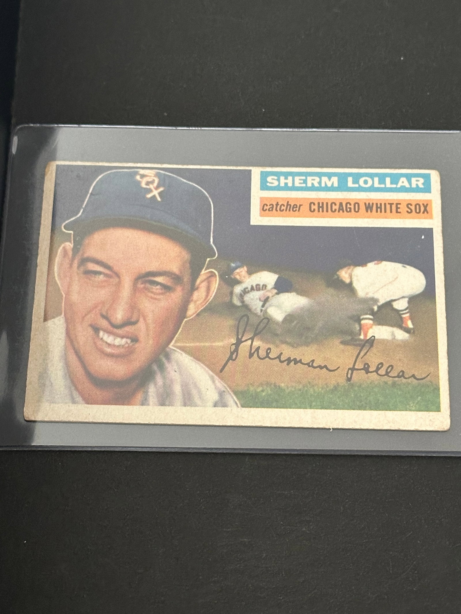 1954 Topps Sherm Lollar Baseball Card: 1954 topps baseball card featuring chicago white sox catcher sherm lollar. The card displays a portrait of the player and a small action shot in the background, along with a facsimile autograph.
