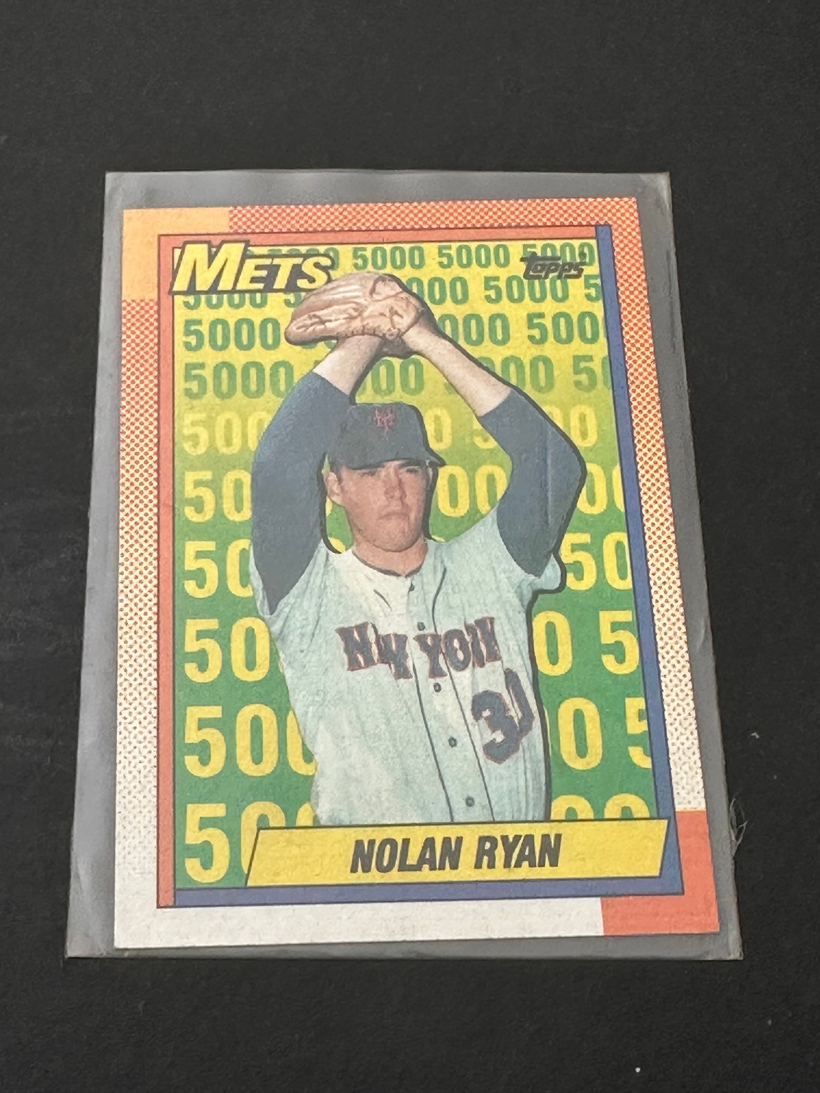 Legendary Pitcher Nolan Ryan: This is a 1991 topps baseball card featuring legendary pitcher nolan ryan. It is part of the rare desert shield subset, identifiable by the distinctive logo on the card front. The card is in a