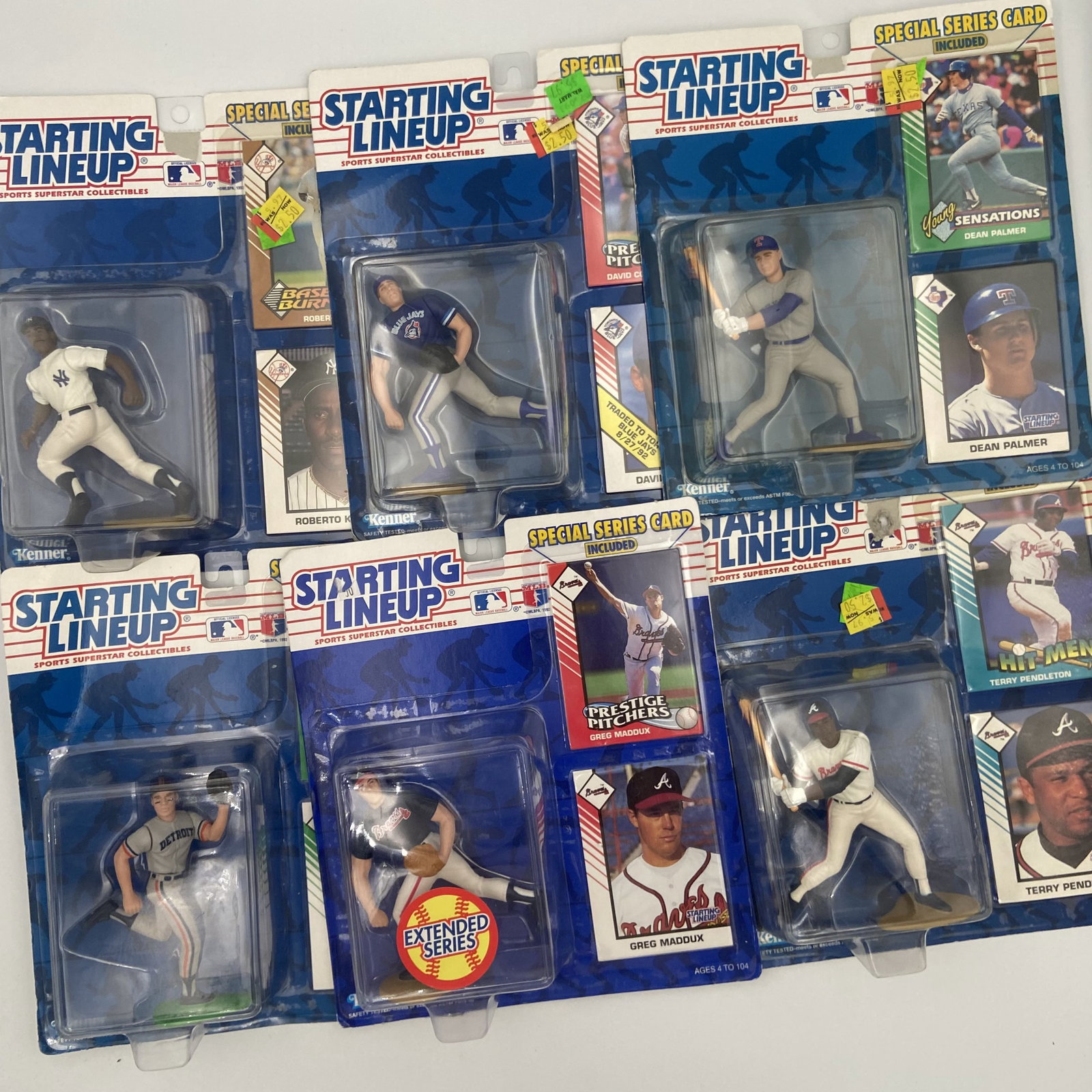 Kenner Starting Lineup MLB Baseball Figures Collection: A collection of 1992 Kenner Starting Lineup Major League Baseball action figures still in their original blister pack packaging. The group includes players such as Greg Maddux, Terry Pendleton, Dean