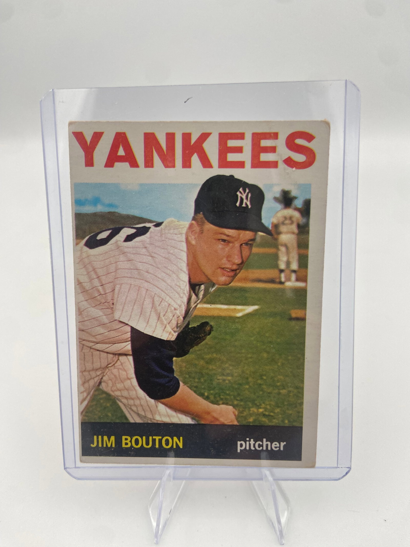 1963 Topps Jim Bouton New York Yankees Baseball Card: This is a 1963 Topps baseball card featuring New York Yankees pitcher Jim Bouton. The card displays the classic vintage design with bold team lettering and the player's name in a vertical sidebar.
