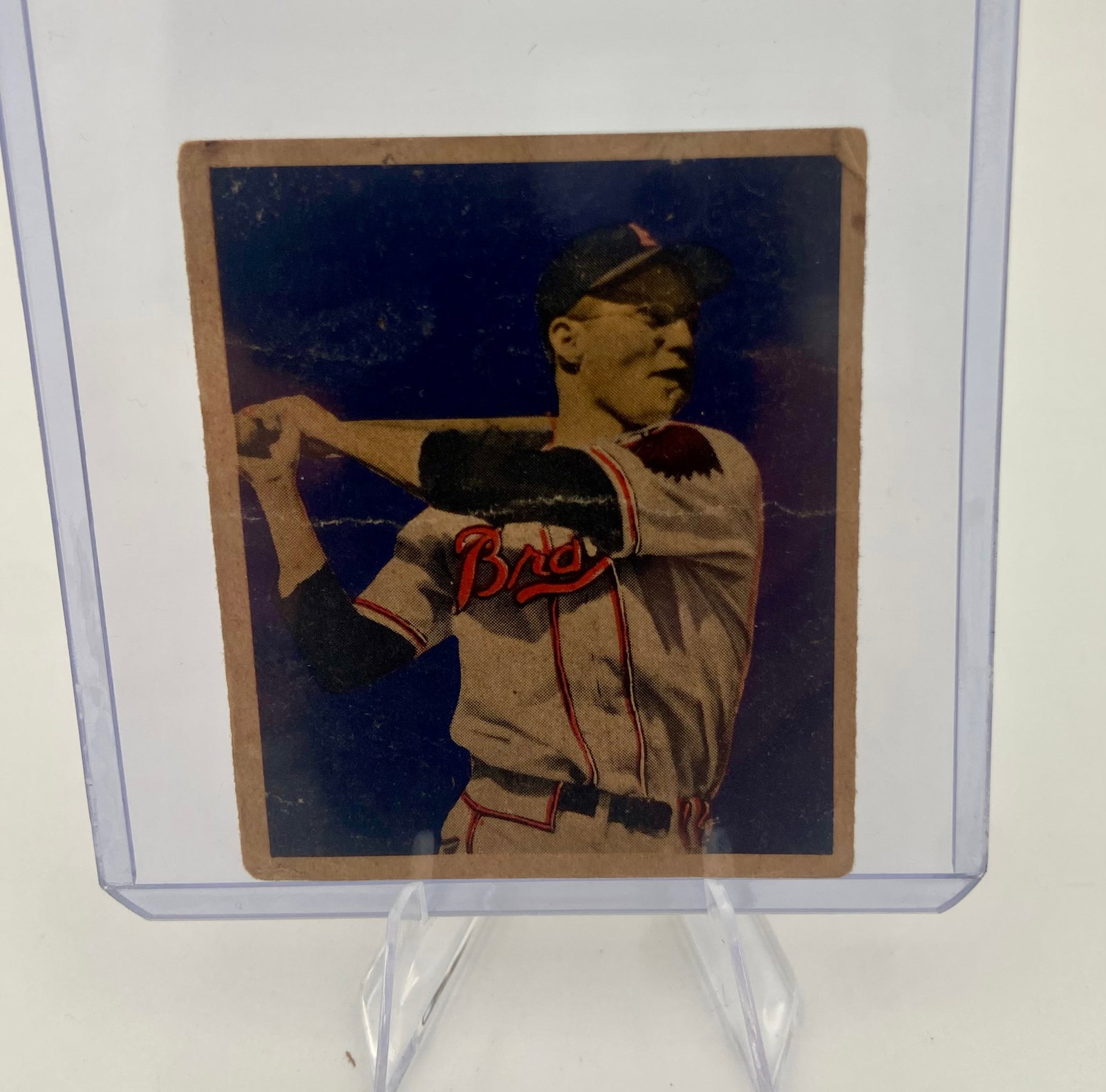 1949 Bowman Earl Torgeson Baseball Card: This is the reverse side of the 1949 Bowman baseball card featuring Earl Torgeson of the Boston Braves. The card includes biographical information and player statistics from his early career. It also