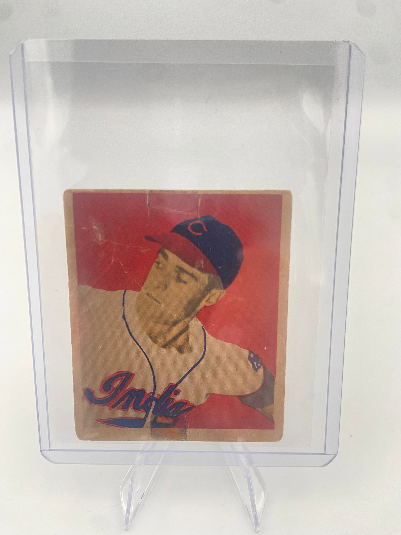 1949 Bowman Gene Bearden #57: 1949 Bowman baseball card featuring Gene Bearden of the Cleveland Indians. The card highlights his biographical details and his recovery from war wounds. It is preserved in a protective plastic
