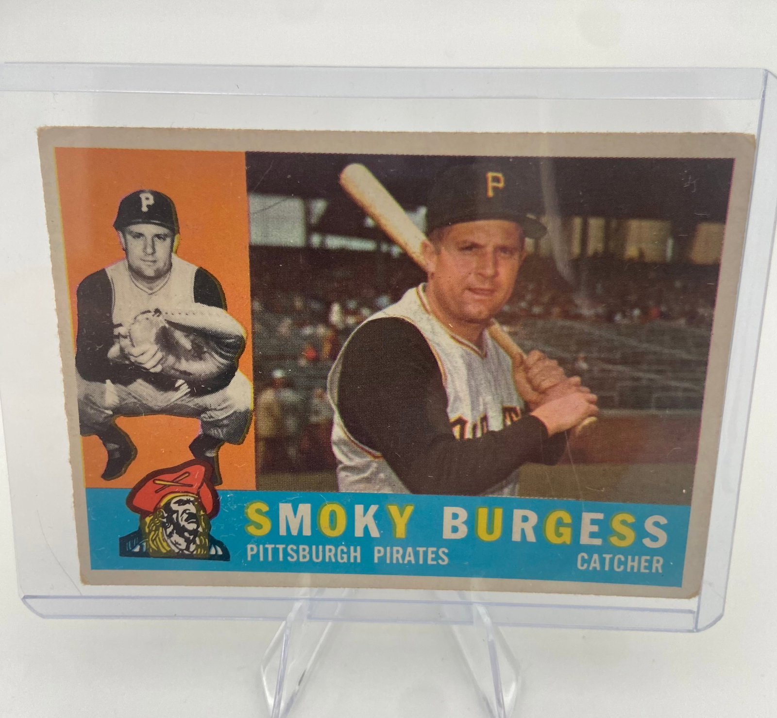 1960 Topps Smoky Burgess Pittsburgh Pirates Baseball Card: This is a 1960 Topps baseball card featuring Smoky Burgess of the Pittsburgh Pirates. The card features a classic dual-image layout with both a portrait and an action shot. It is preserved inside a