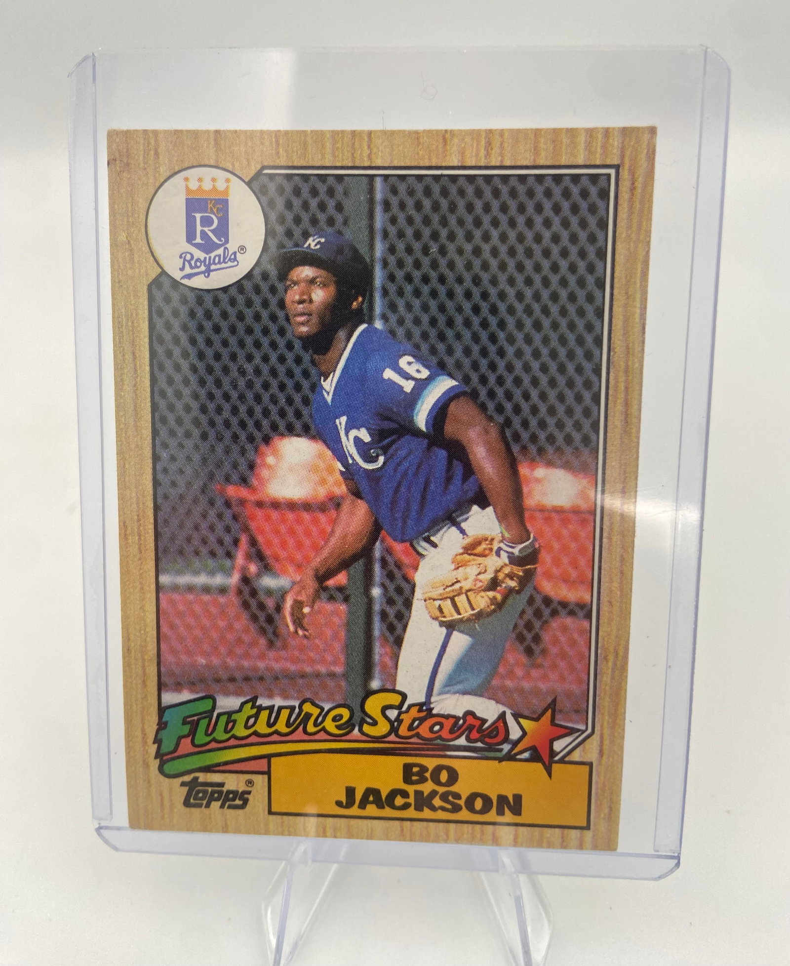 1987 Topps Bo Jackson Future Stars Rookie Card: This is a 1987 Topps baseball card featuring Bo Jackson of the Kansas City Royals. The card is marked as a Future Stars rookie card and features the classic wood-grain border design characteristic of