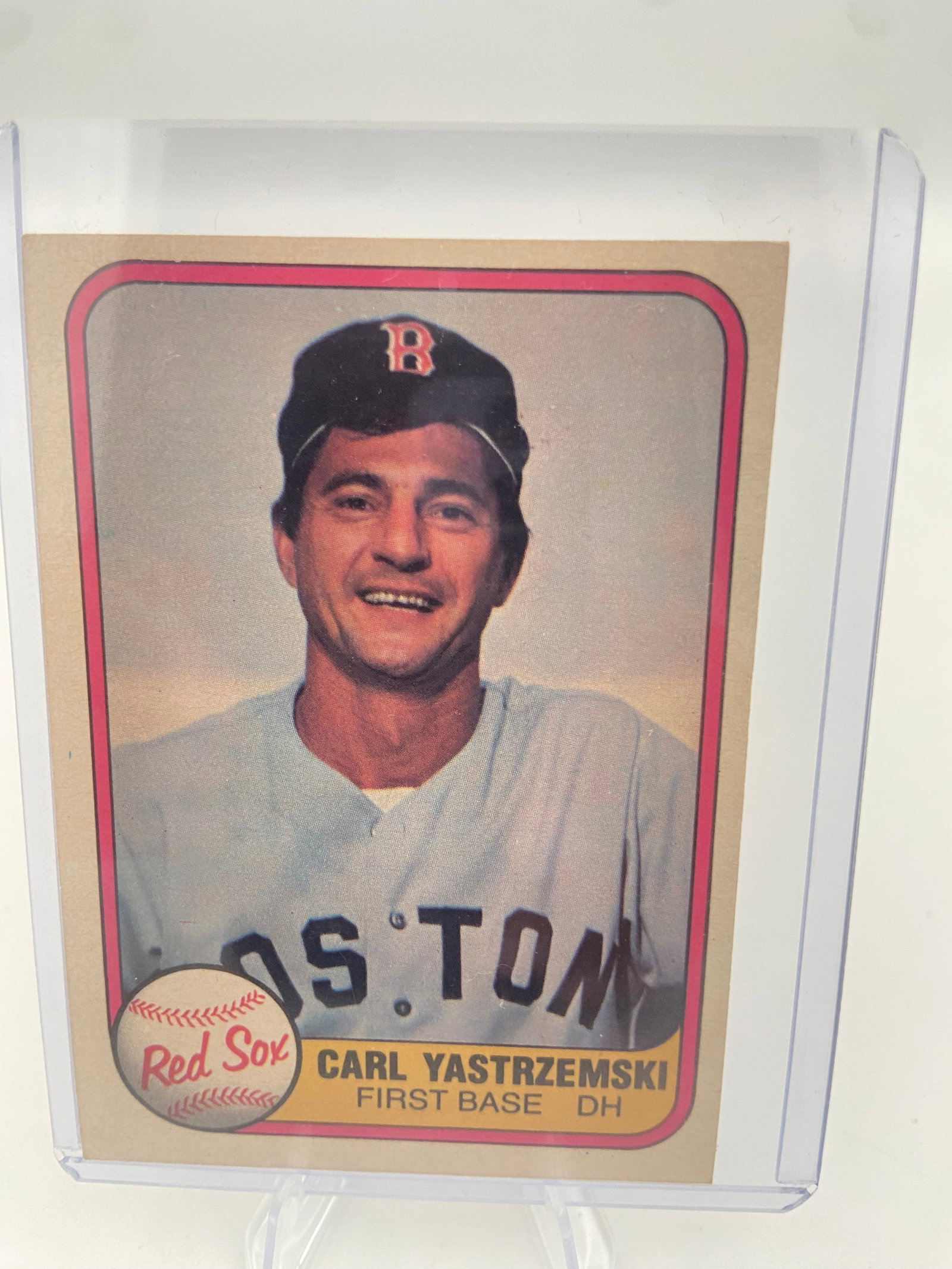 1973 Topps Carl Yastrzemski Baseball Card: This is a 1973 Topps baseball card featuring Red Sox legend Carl Yastrzemski. The card captures a portrait shot of the Hall of Fame outfielder and first baseman with the Red Sox team logo displayed