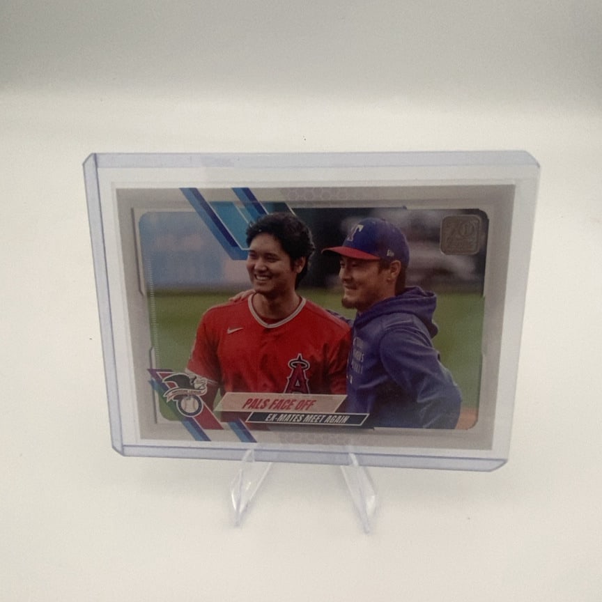 2021 Topps Baseball Pals Face Off Shohei Ohtani Card: 2021 Topps Baseball trading card titled 'Pals Face Off' featuring Shohei Ohtani of the Los Angeles Angels and Yu Darvish of the San Diego Padres. The card captures a friendly moment between the two