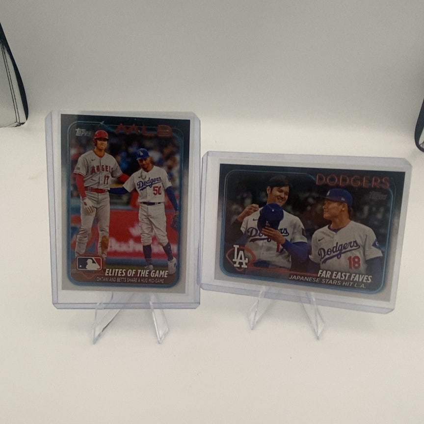 Shohei Ohtani Mookie Betts Topps Trading Card Set: lot features two Topps baseball trading cards highlighting Shohei Ohtani and Mookie Betts. One card is titled Elites of the Game, while the other is titled Far East Faves, both commemorating their tim