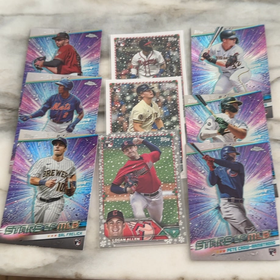 Baseball Trading Card-A collection of Rookie Cards: A collection of 2024 Topps baseball cards featuring Stars of MLB Chrome inserts and Holiday parallels. Visible players include Sal Frelick, Pete Crow-Armstrong, and Logan Allen.