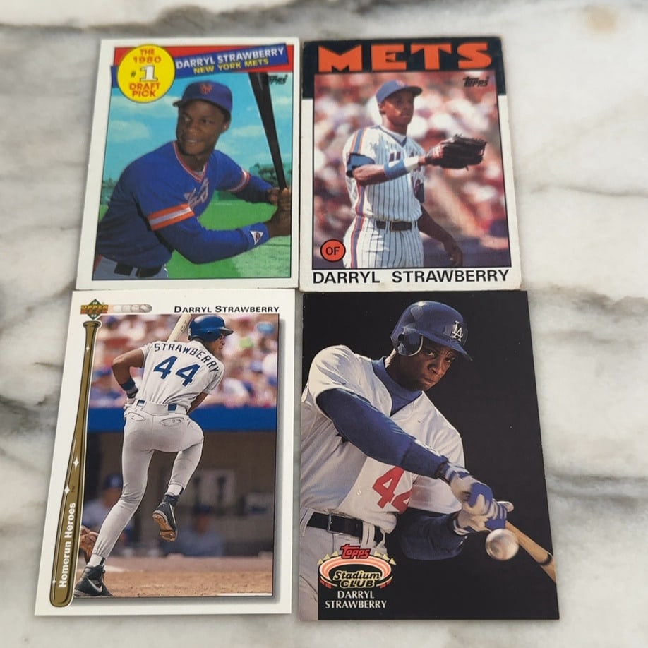 Darryl Strawberry collection: This lot features four baseball cards of player Darryl Strawberry. The collection includes various issues from brands such as Topps and Upper Deck.Raw - ungraded - condition is as shown and sold as is