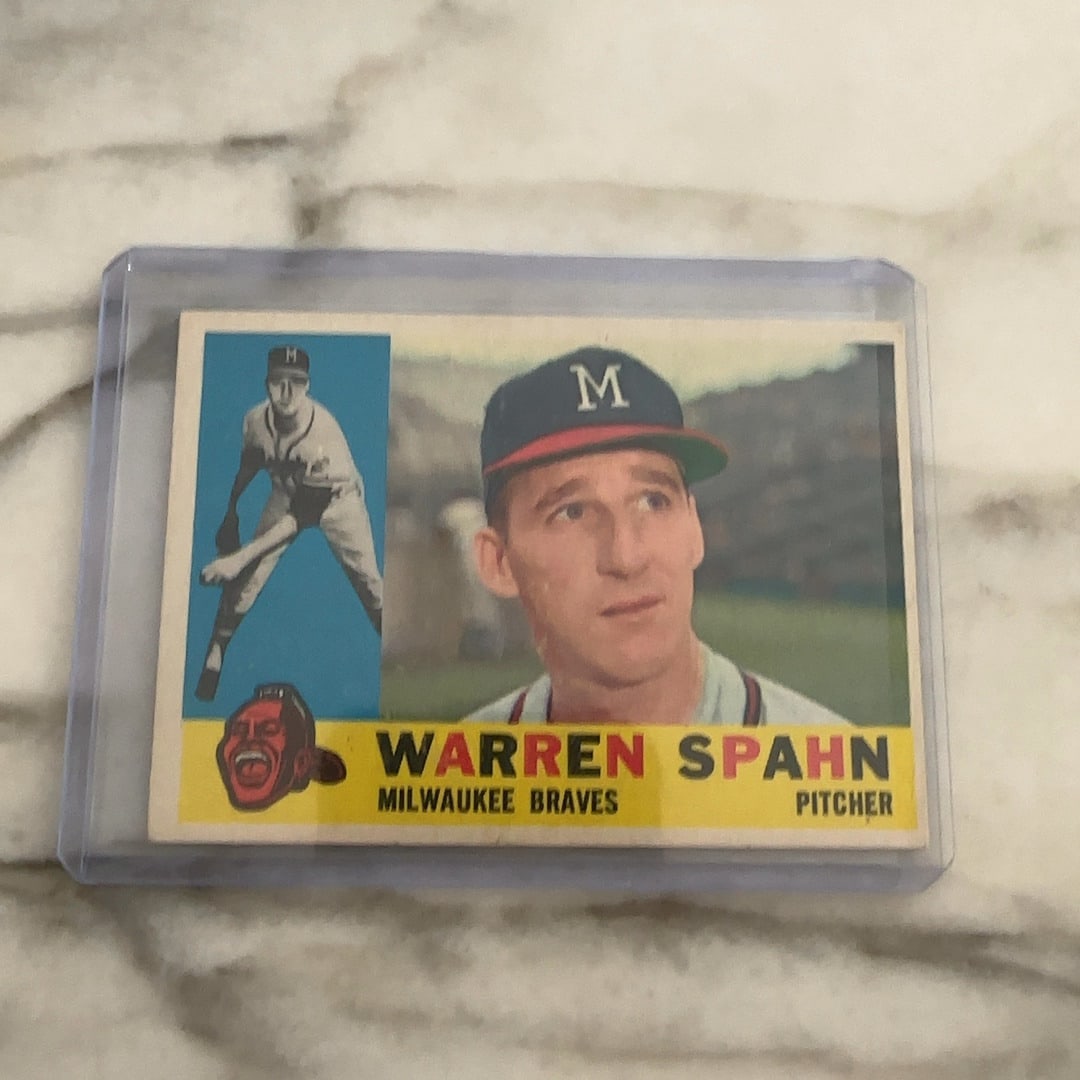 1960 Topps Warren Spaun: 1960 Topps vintage baseball card featuring professional pitcher Warren Spahn of the Milwaukee Braves. Raw - ungraded - condition is as shown and sold as is