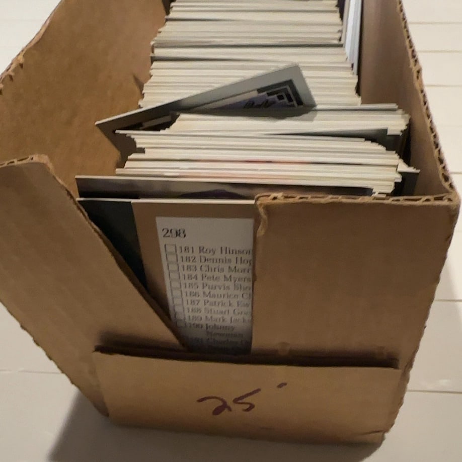 1992 Leaf baseball cards- Sports Trading Cards: 1992 Leaf baseball cards in a storage box. The foreground card features Dennis Eckersley of the Oakland Athletics, and the card behind it features Curt Schilling of the Houston Astros.Unsorted small
