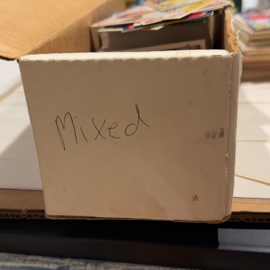 Mixed Years and Brands MLB- Sports Trading Cards: This is a white cardboard storage box filled with an assortment of trading cards. The front of the box has the word Mixed written on it in black marker. Inside, multiple stacks of cards are