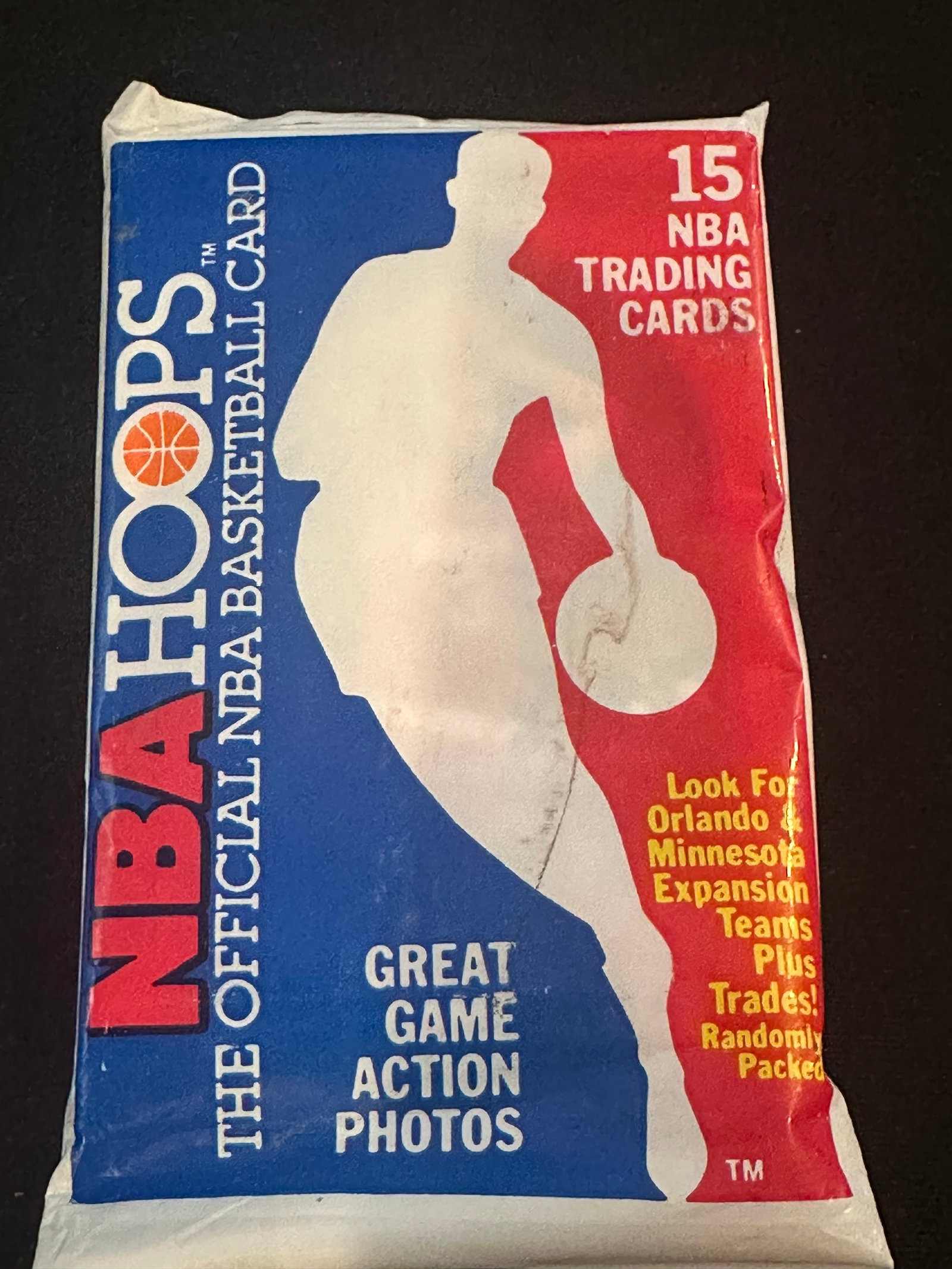 1989-90 NBA Hoops Basketball Wax Pack: This is an original unopened wax pack of 1989-90 NBA Hoops basketball trading cards. The pack contains 15 cards and features the iconic debut design for the Hoops brand, which includes key rookie card