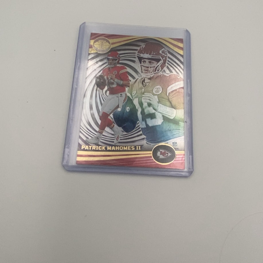 2021 Panini Rookies & Stars Crusade Tom Brady: This is a 2021 Panini Rookies & Stars Crusade Tom Brady football card. It features a red parallel design with Brady in his Tampa Bay Buccaneers uniform.