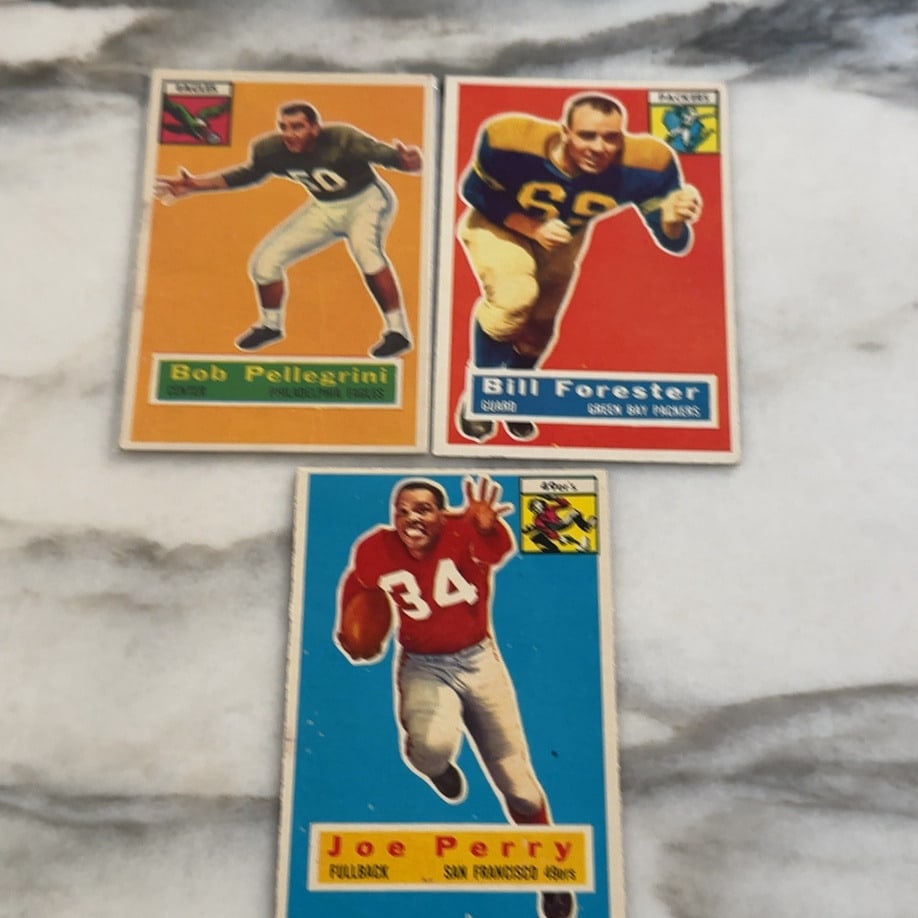 1960 Topps Football Card Trio: This lot features three vintage football trading cards from the 1960 Topps set, depicting players Bob Pellegrini, Bill Forester, and Joe Perry. Each card displays the player's name, position, and team