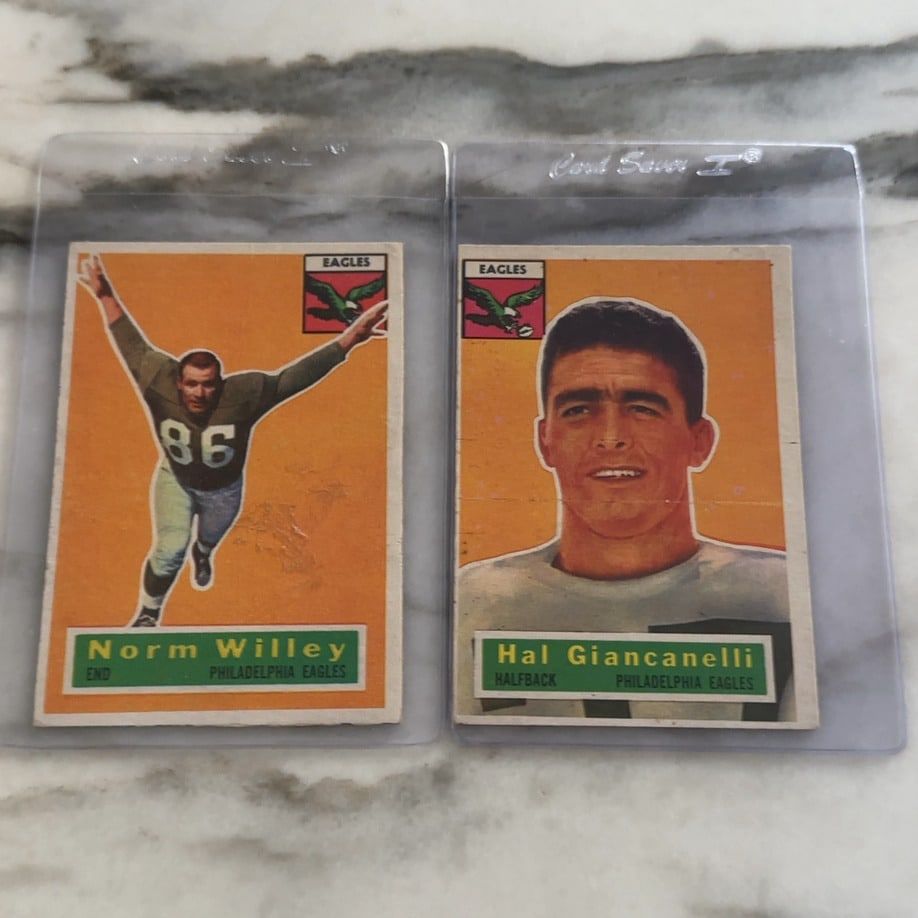 Norm_Willey_and_Hal_Giancanelli_Eagles_Cards: Two 1954 Bowman Philadelphia Eagles football cards featuring Norm Willey and Hal Giancanelli, displayed in plastic sleeves.