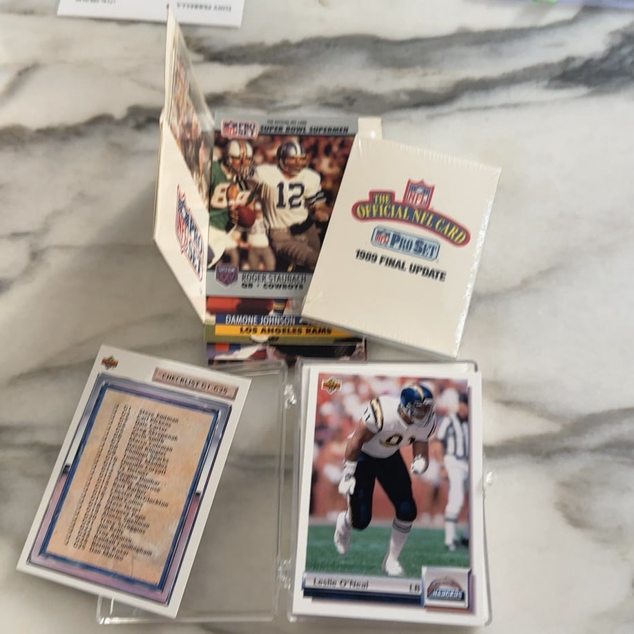 1989 Pro Set and Upper Deck Football Card Collection: This image features a collection of 1989 football cards, including an unopened 1989 Pro Set Final Update factory set. The visible cards include a 1989 Pro Set Roger Staubach 'Super Bowl Supermen'