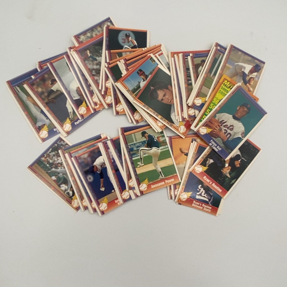 1991 Pacific Nolan Ryan Baseball Card Lot: This is a collection of various Nolan Ryan baseball cards from the 1991 Pacific set featuring different action shots and highlights. The cards include themes like 'Awesome Power' and 'Ryan's Routine',
