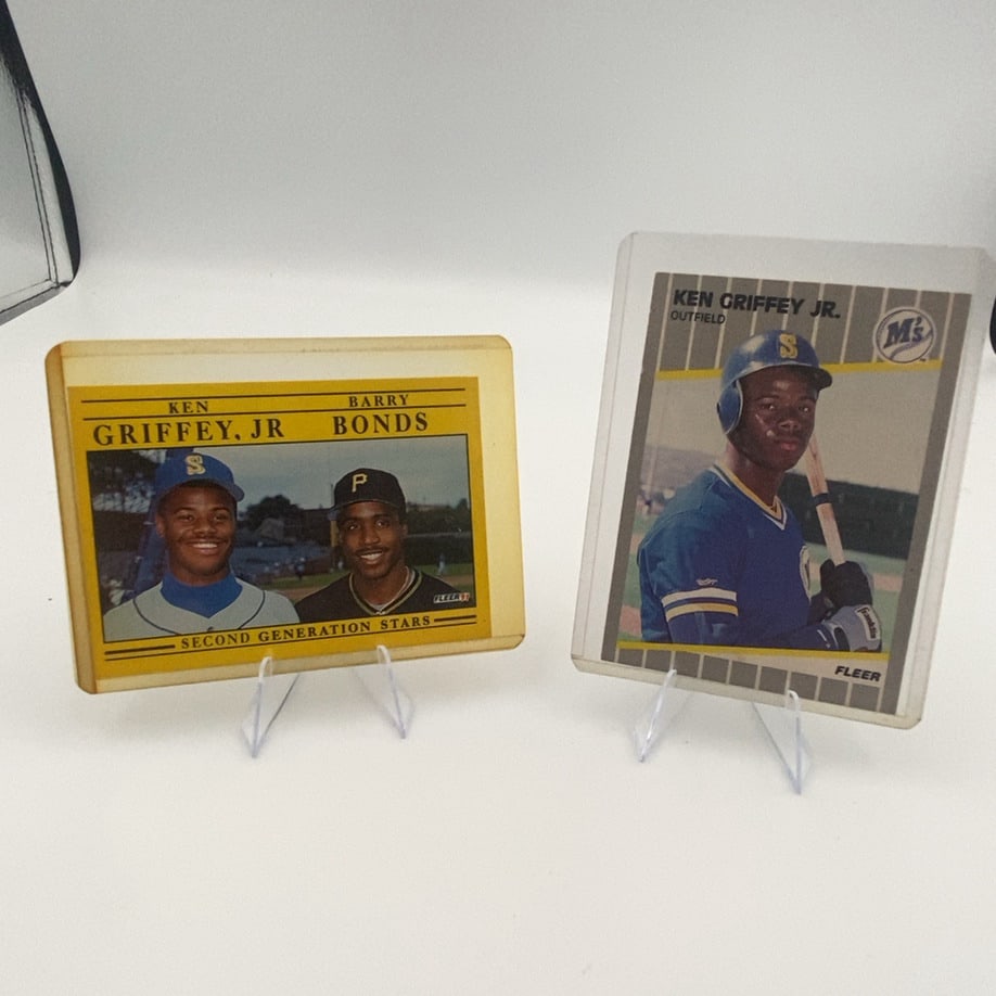 1991 Fleer Ken Griffey Jr and Barry Bonds Cards: lot features two vintage baseball cards from 1991 produced by Fleer. One card highlights Ken Griffey Jr. individually (#450), while the other card features both Ken Griffey Jr. and Barry Bonds labeled
