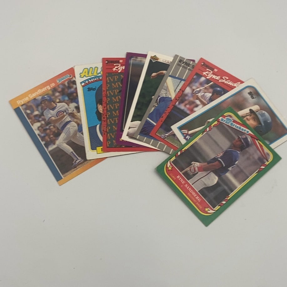 Ryne Sandberg Baseball Card Lot: a collection of various baseball cards featuring Ryne Sandberg of the Chicago Cubs. Several different manufacturers and card designs Raw - ungraded - condition is as shown and sold as is