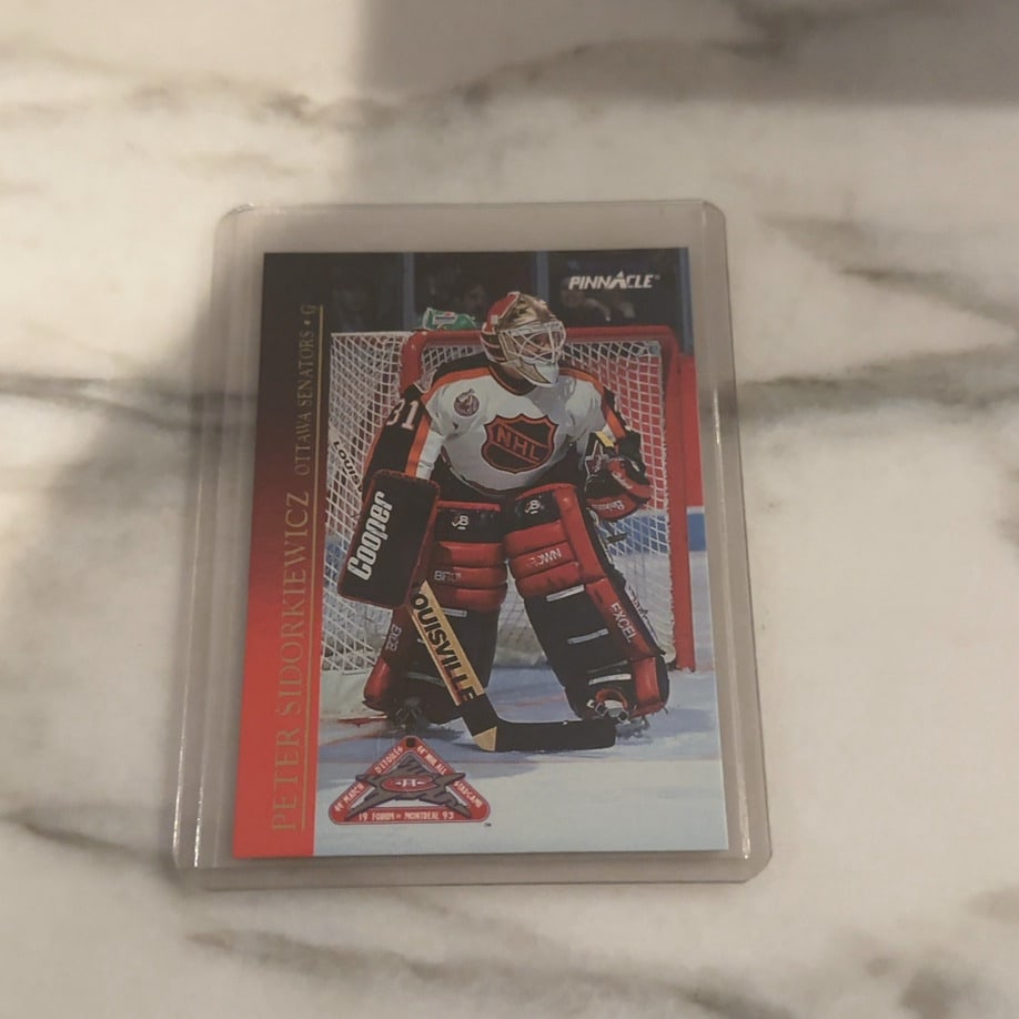 1993 Pinnacle Peter Sidorkiewicz All-Star Game Card: This is a 1993 Pinnacle NHL trading card featuring goaltender Peter Sidorkiewicz of the Ottawa Senators. The card commemorates the 1993 NHL All-Star Game held at the Montreal Forum and is preserved