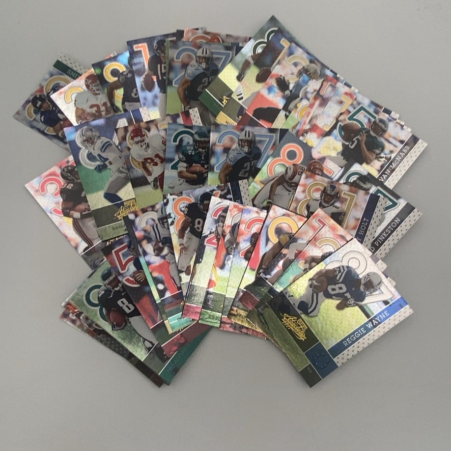 2007 Playoff Absolute Memorabilia Football Card Lot: This is a collection of football trading cards from the 2007 Playoff Absolute Memorabilia series. The cards feature various NFL players such as Reggie Wayne, Torry Holt, and Donovan McNabb. Each card 