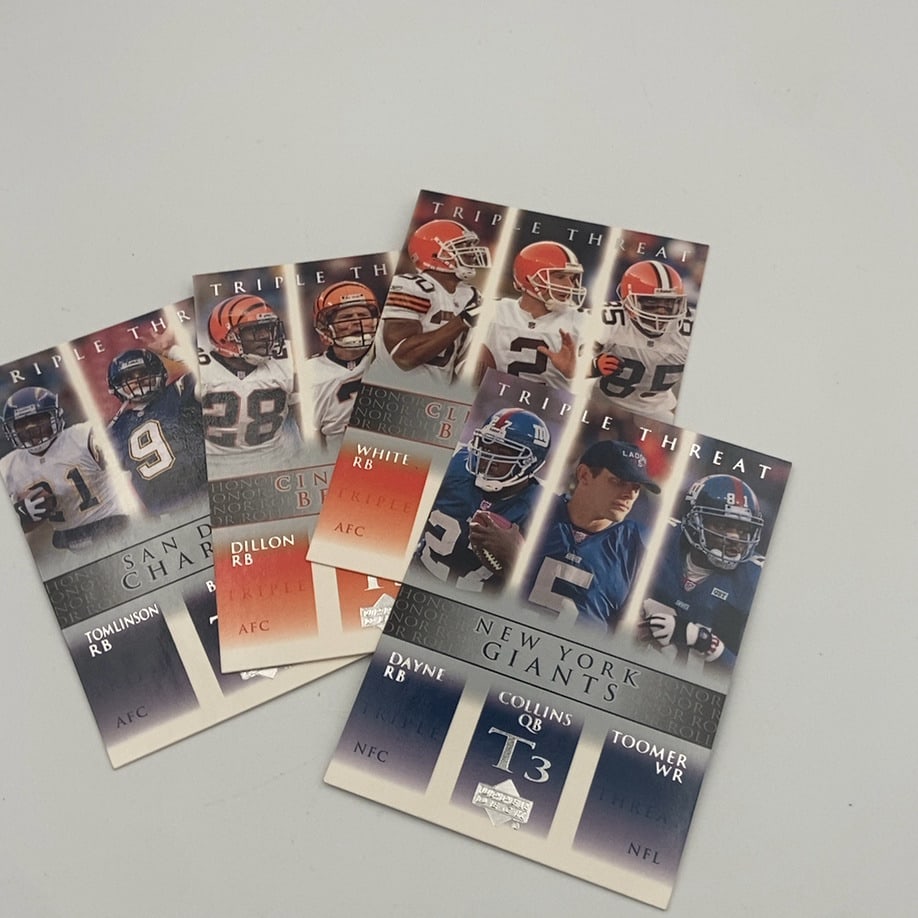 Football Trading Card: A lot of four 2002 Upper Deck Honor Roll 'Triple Threat' football trading cards. The cards feature player trios from the New York Giants (Ron Dayne, Kerry Collins, Amani Toomer), San Diego Chargers (f