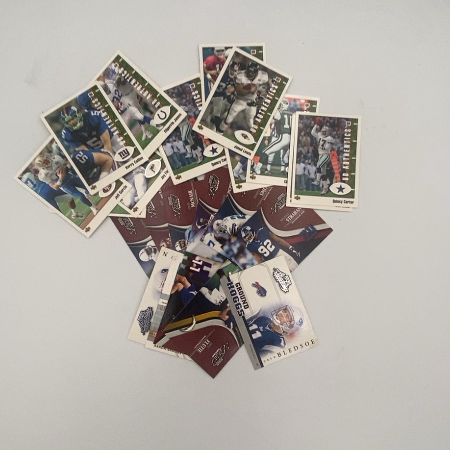 Football Trading Card Lot: This is a collection of various NFL football trading cards featuring multiple players such as Drew Bledsoe, Quincy Carter, and Jamal Lewis. The cards include branding from Upper Deck (UD Authentics) a
